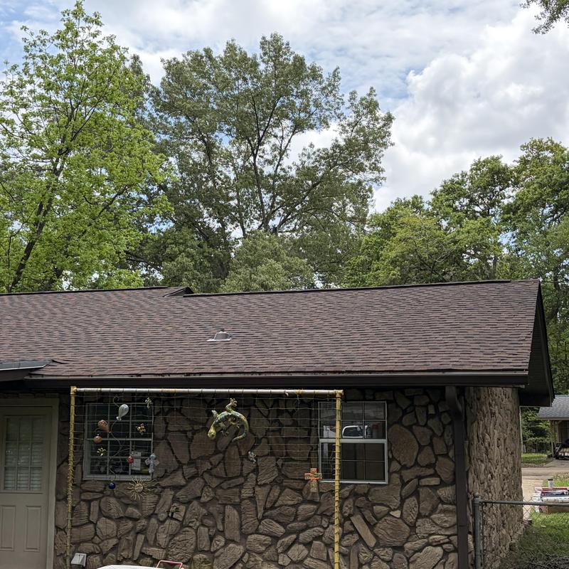 HDZ architectural shingle roof on stone house