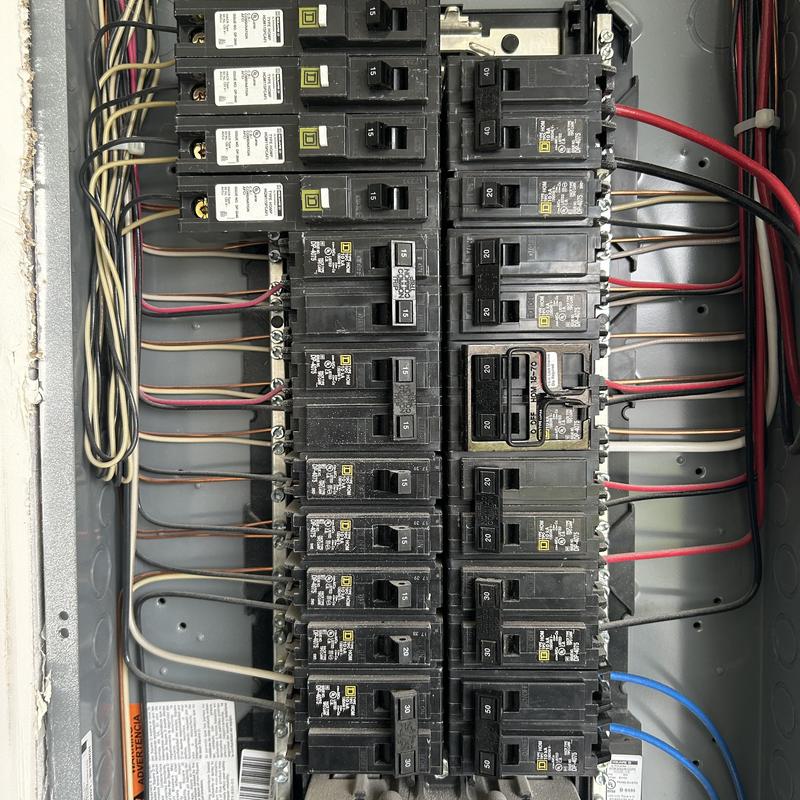 Electrical breaker panel with circuit breakers and wiring