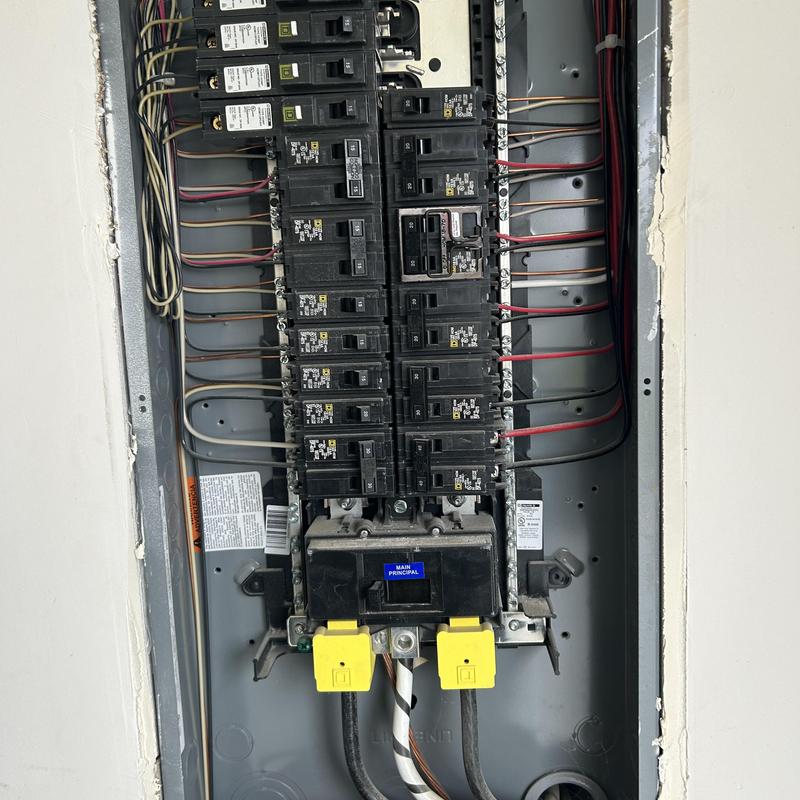 Electrical breaker panel with new single pole breakers installed