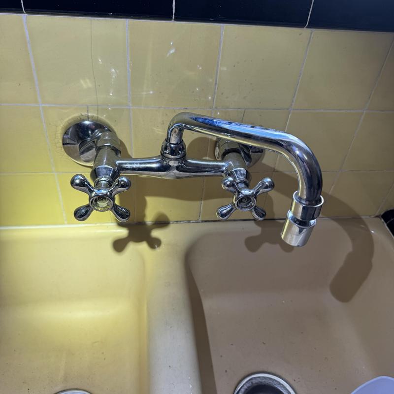 Kitchen faucet with wall-mounted handles and spout