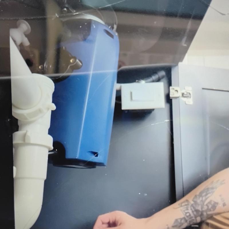 Garbage disposal and basket strainer installation under sink