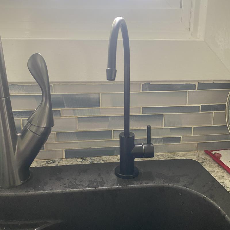 RO water filtration faucet installed on kitchen sink RO water filtration faucet installed on kitchen sink