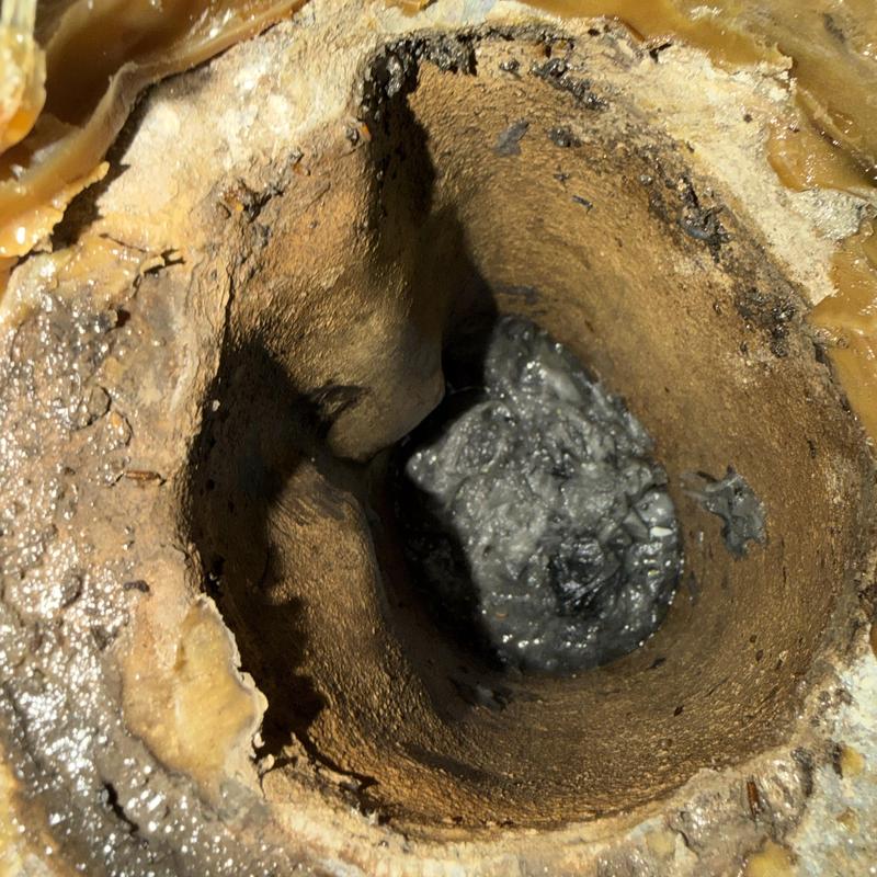 Main line pipe clogged with debris inside view Main line pipe clogged with debris inside view
