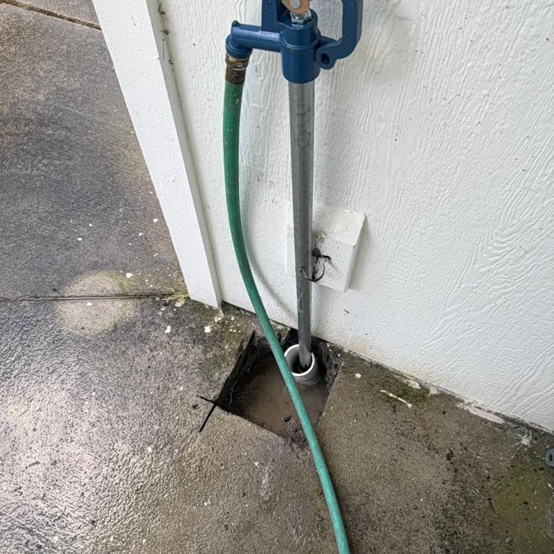 Yard hydrant installation with exposed water line