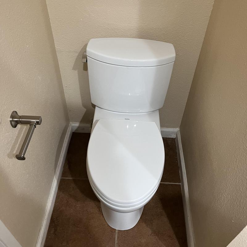 Toto Drake 2 toilet installed in bathroom corner Toto Drake 2 toilet installed in bathroom corner