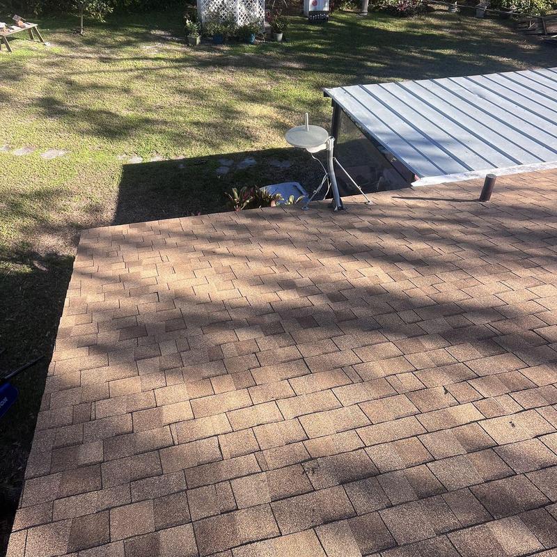 Architectural shingle roof with satellite dish and patio cover