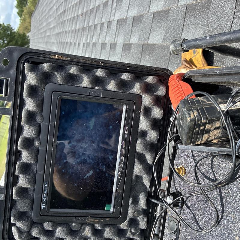 Sewer camera monitor in protective case on roof