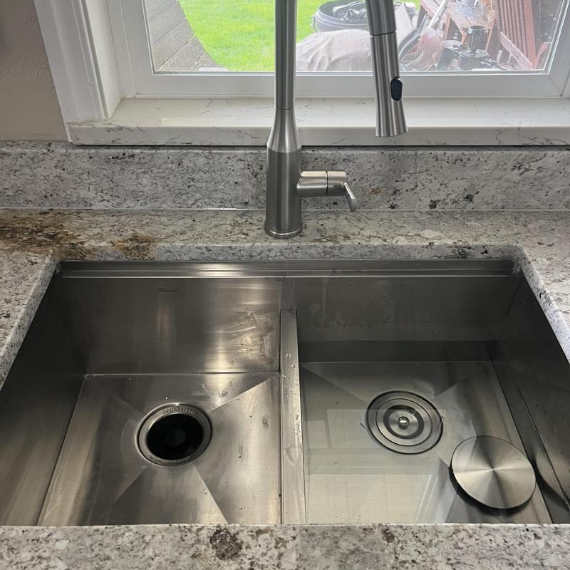 Stainless steel double kitchen sink with new faucet Stainless steel double kitchen sink with new faucet