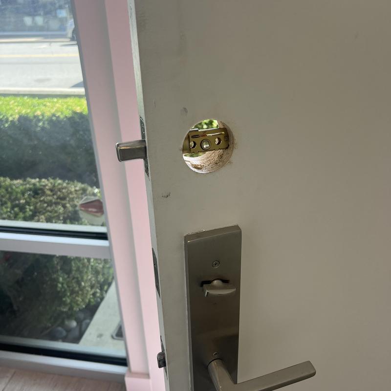 Door keypad mounting hole on residential door
