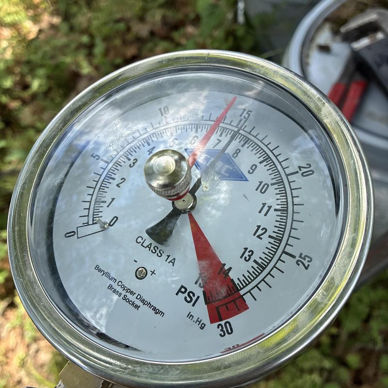 Water heater pressure gauge showing 15 PSI reading