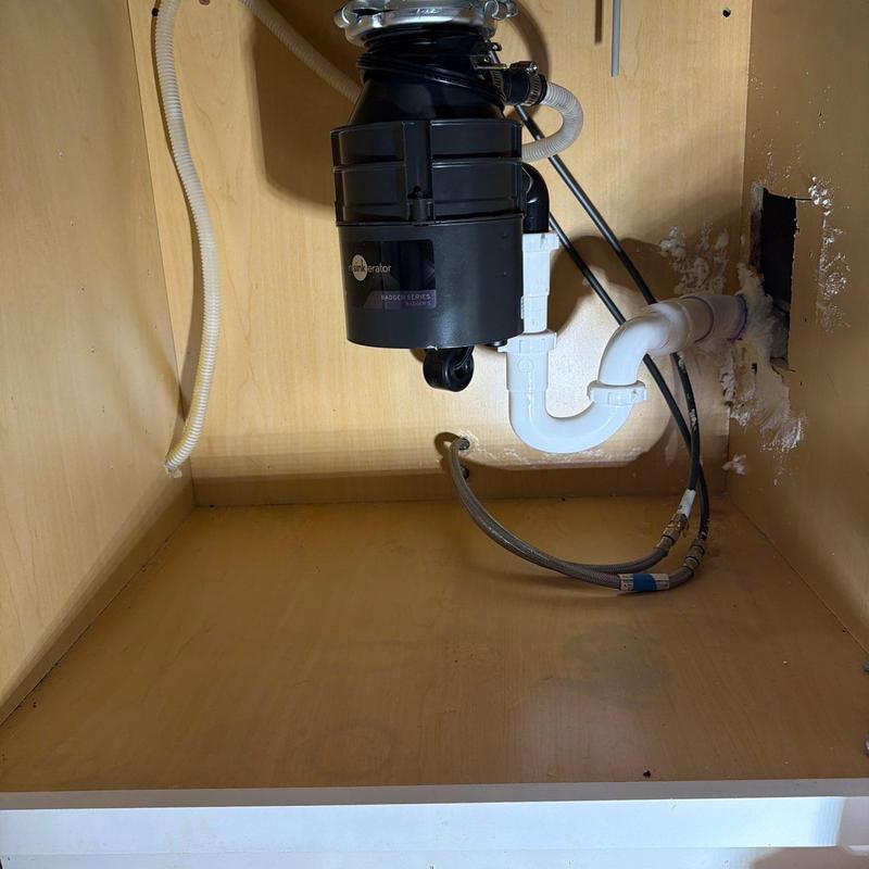 Garbage disposal and drain pipe replacement under sink
