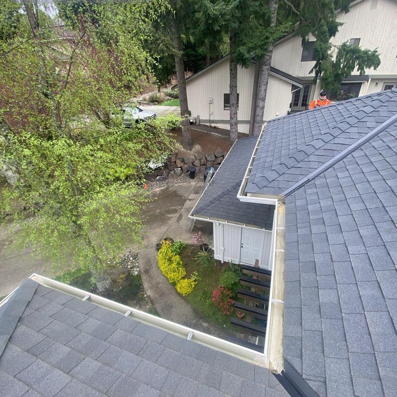 Gutter cleaning and roof debris removal on residential home Gutter cleaning and roof debris removal on residential home