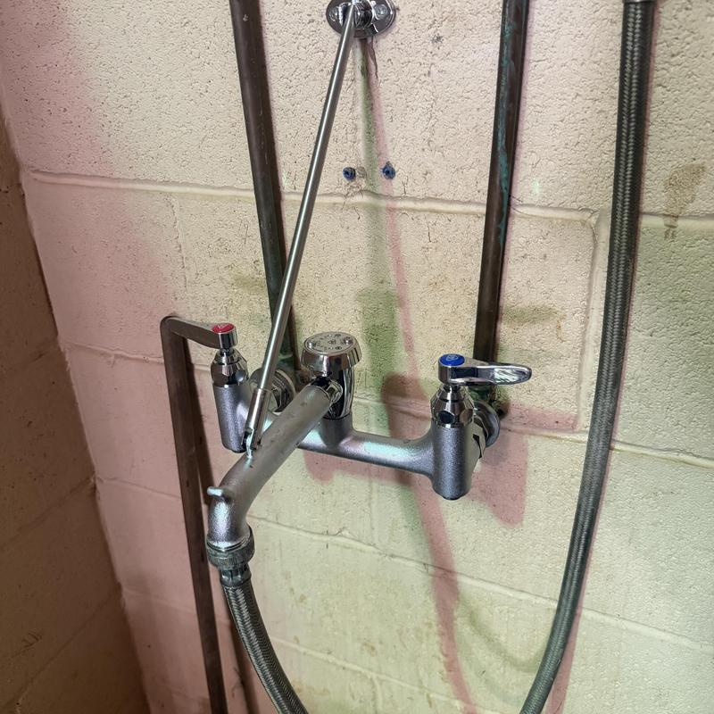 Wall mount service faucet installation on concrete wall