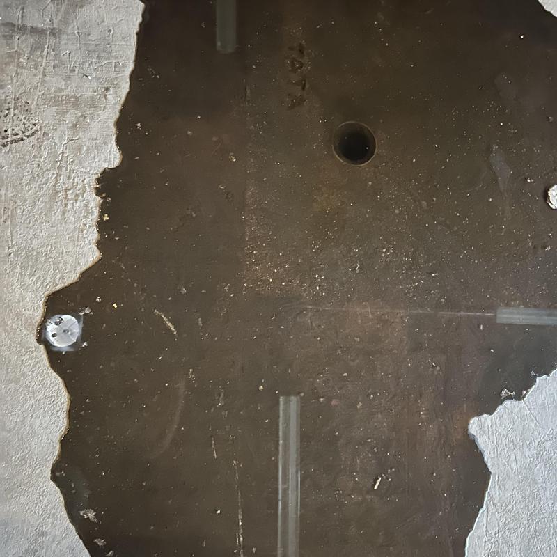 Floor drain with standing water and debris Floor drain with standing water and debris