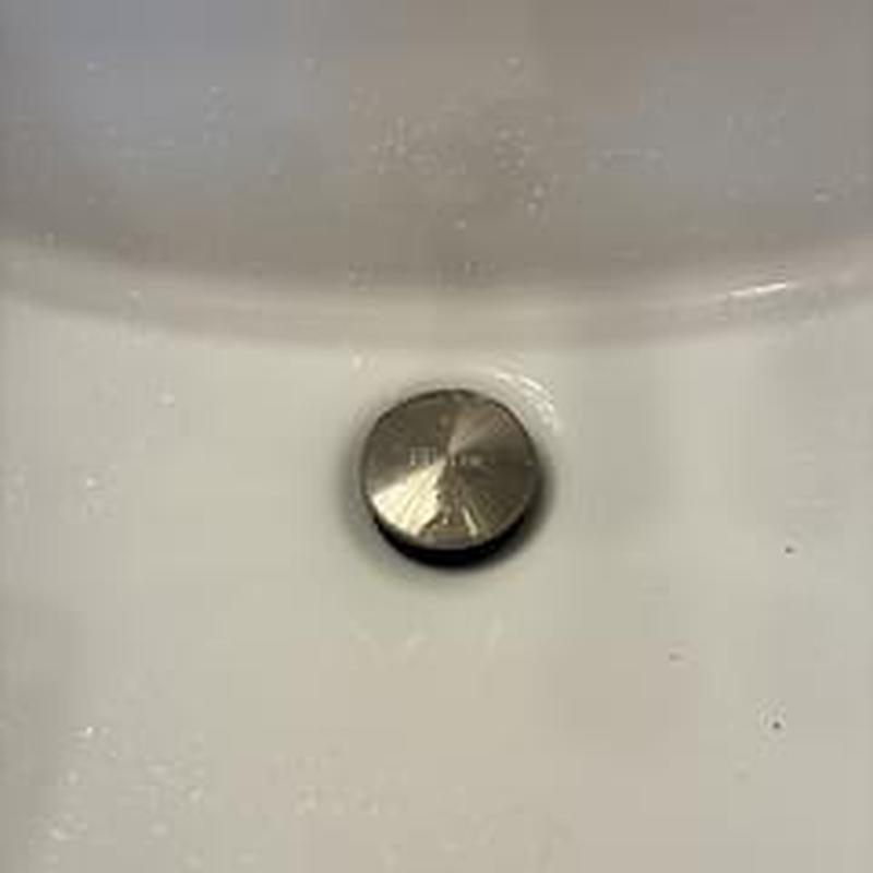Pop-up drain assembly in master bathroom sink