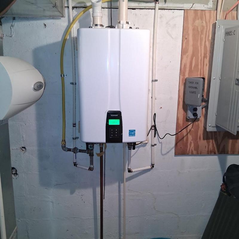 Tankless water heater installation with piping
