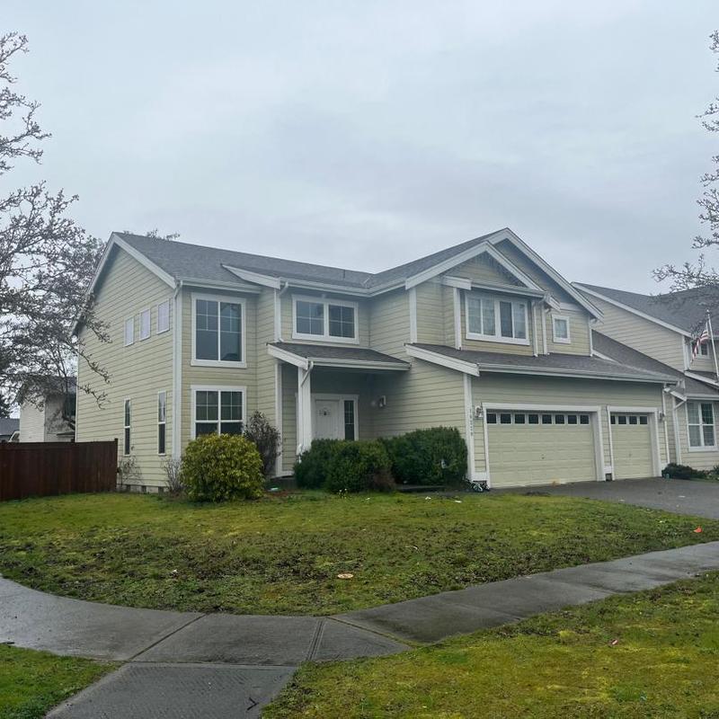 Asphalt shingle roof on two-story residential house