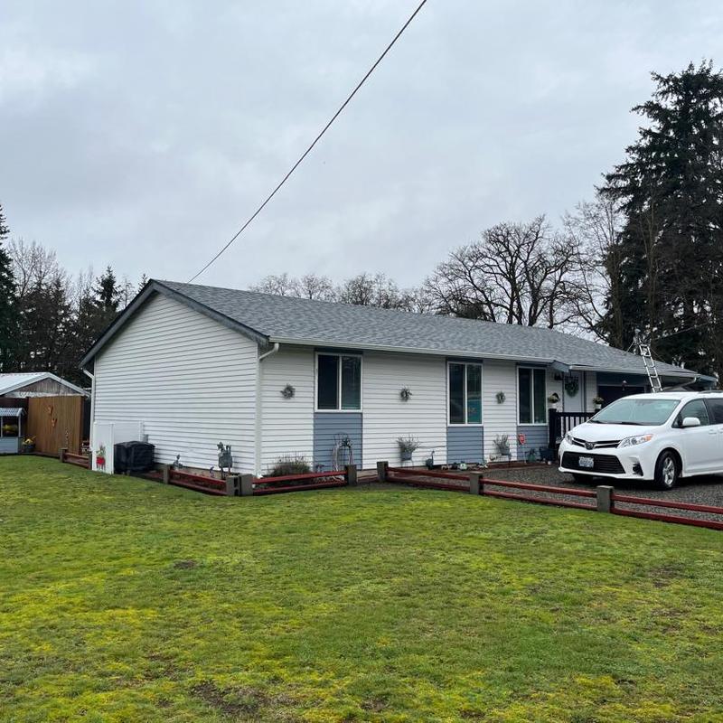 Residential asphalt shingle roof on single-story home