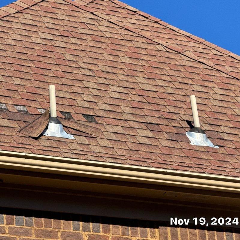 Owen Corning Oakridge asphalt shingles with vent pipes
