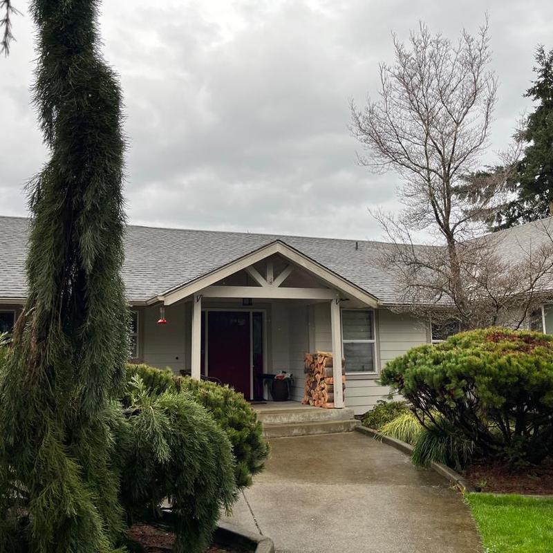 Asphalt shingle roof and front porch area