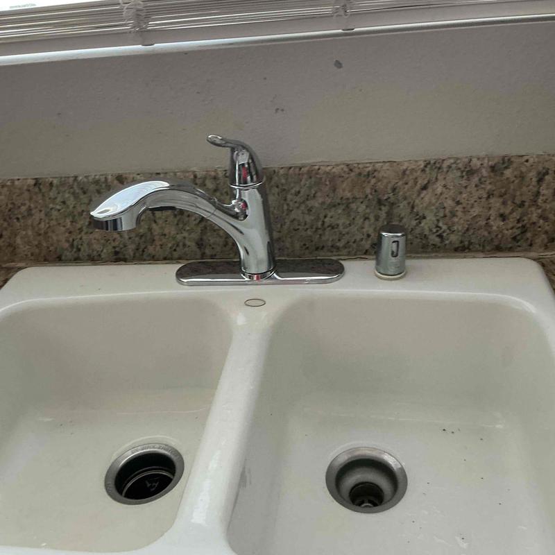 Economy faucet with sprayer on double sink