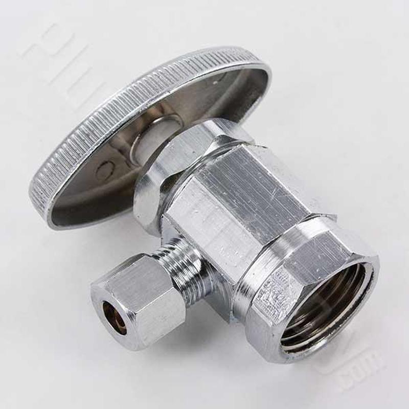 Angle stop valve under kitchen sink close-up view