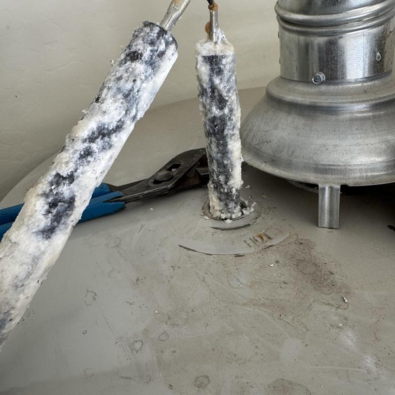 Water heater electrodes covered in mineral buildup Water heater electrodes covered in mineral buildup
