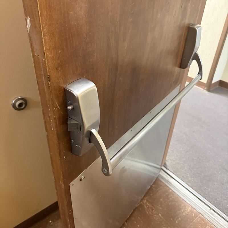 Kaba Simplex exit device on stairwell door