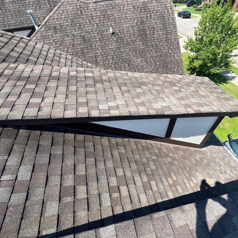 Asphalt shingle roof with granule loss and hail damage
