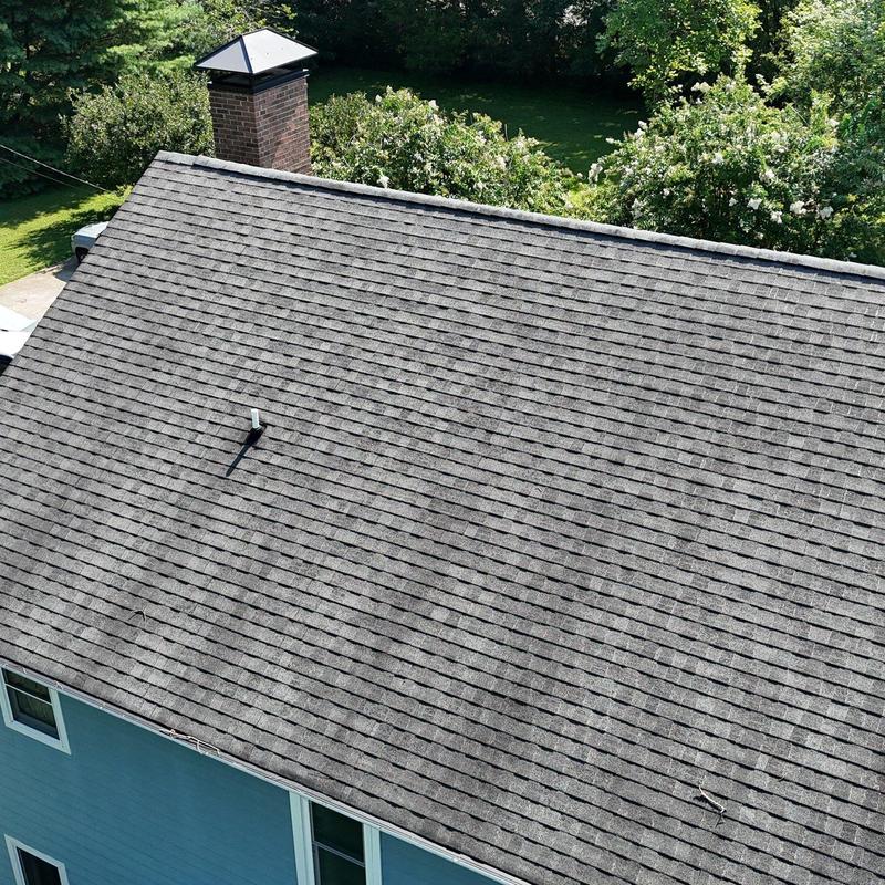 Asphalt shingle roof with hail damage inspection