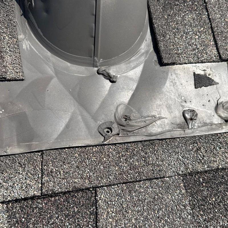 Roof flashing with hail damage and shingle wear