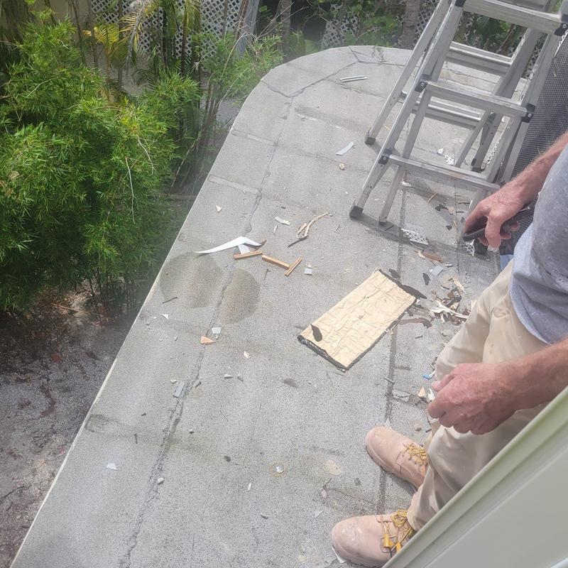 Flat roof surface with leak inspection debris