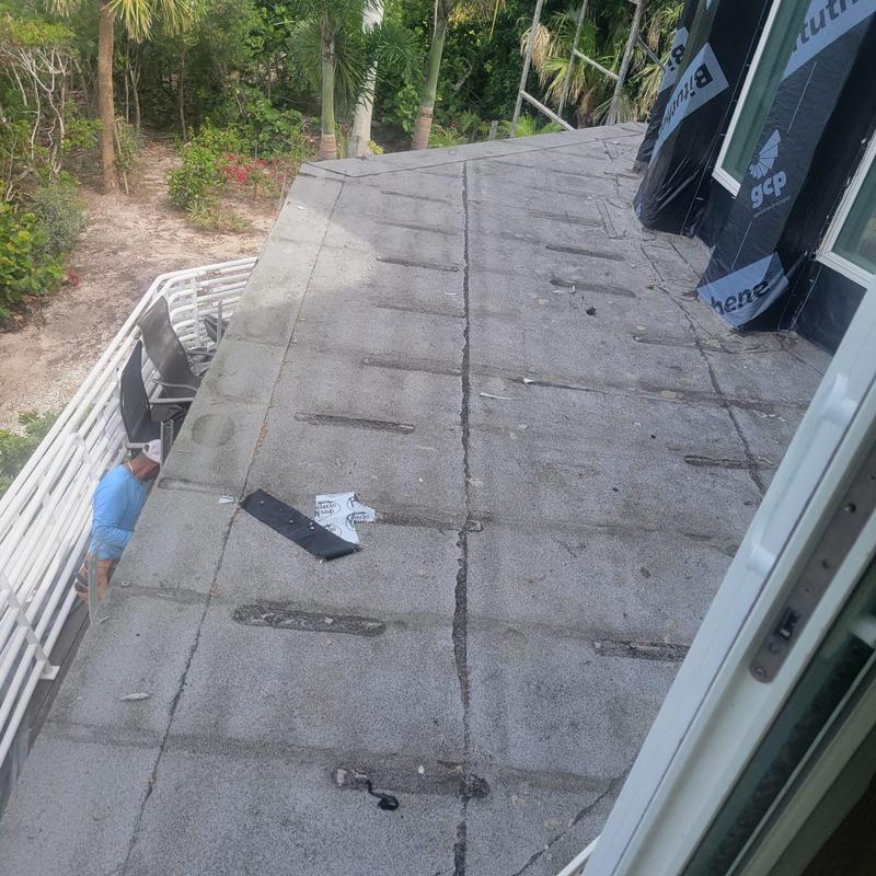 Flat roof membrane with signs of water damage and wear
