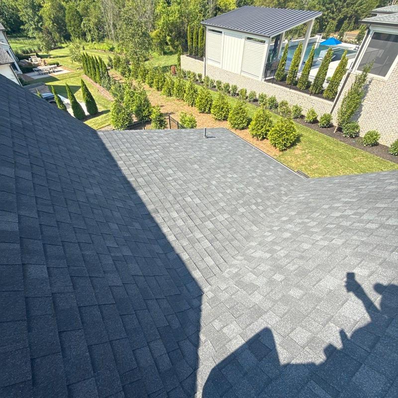 Asphalt shingle roof inspection with visible hail damage