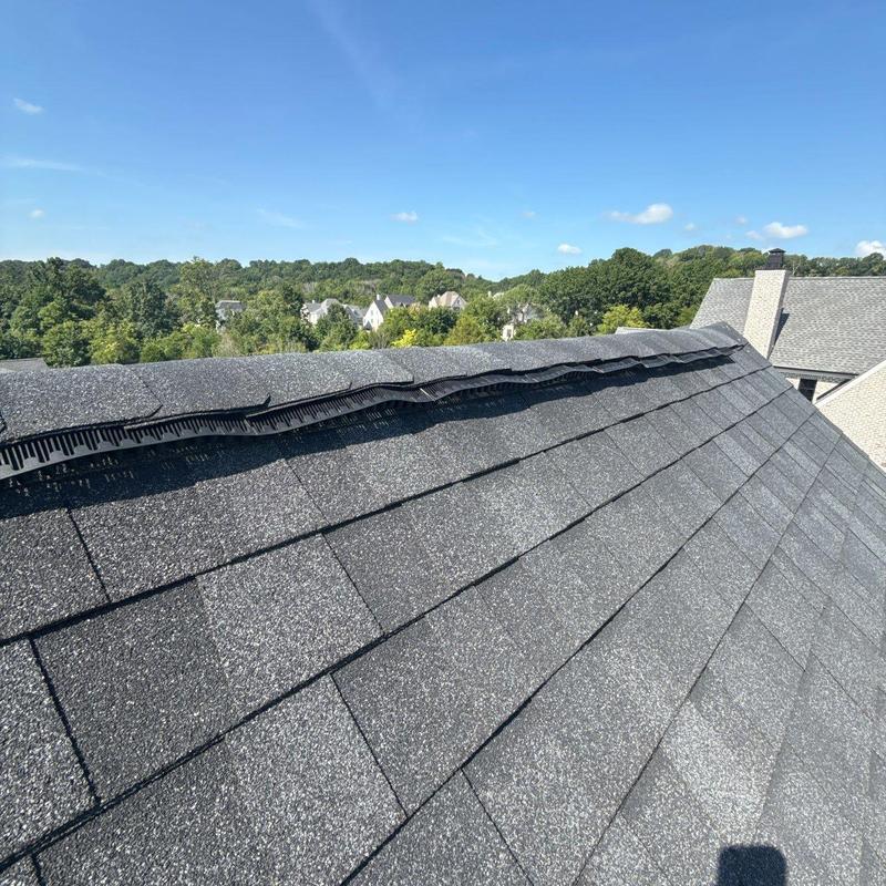 Asphalt shingle roof with ridge vent installation