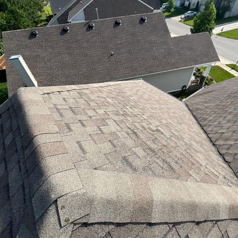 Asphalt shingle roof with visible hail damage