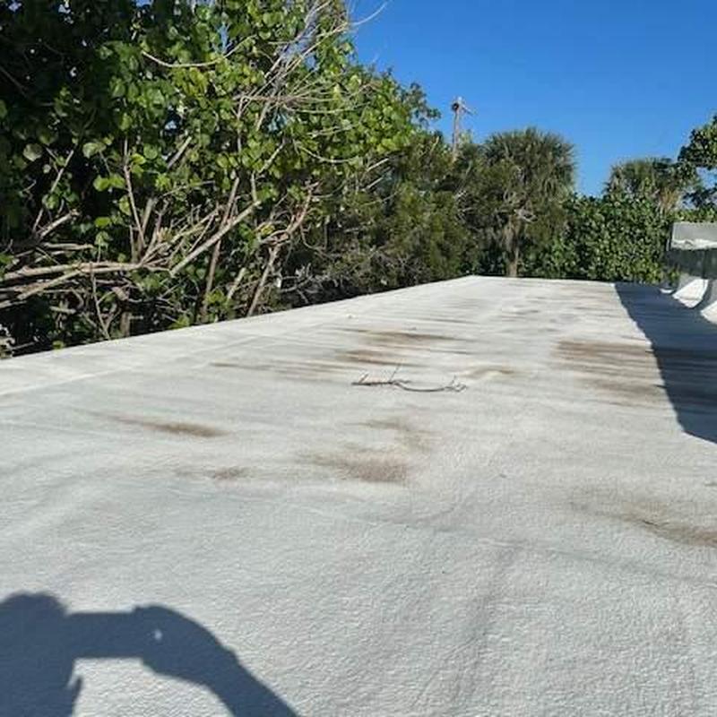 SPF spray foam commercial roof with ponding water spots