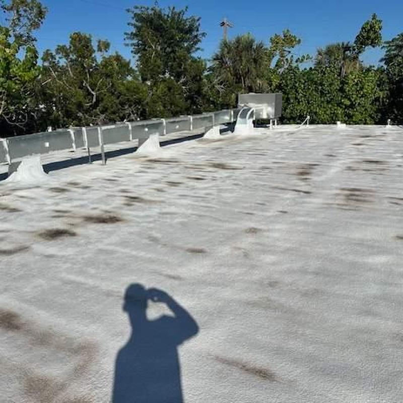 Spray foam flat roof with elastomeric coating defects