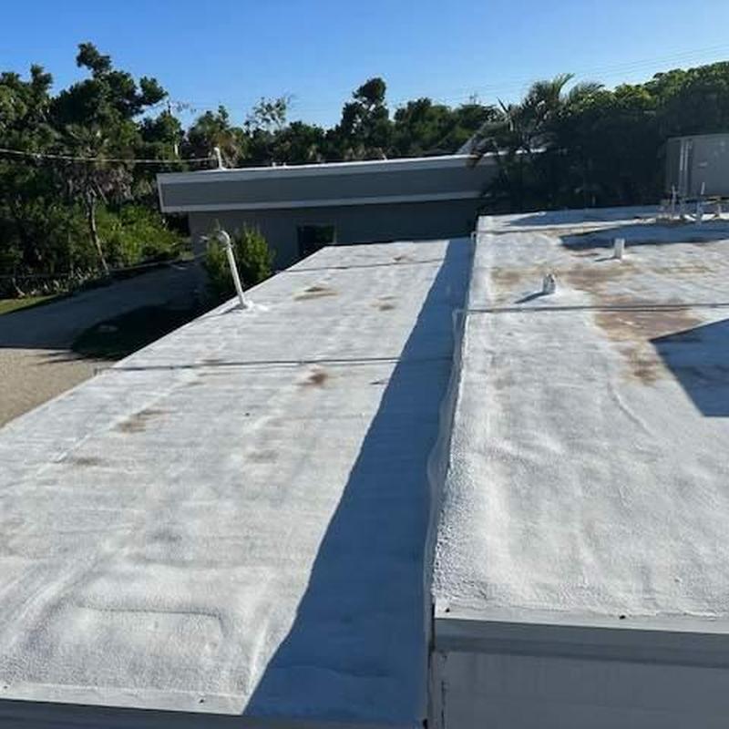 SPF flat roof with elastomeric coating and ponding water