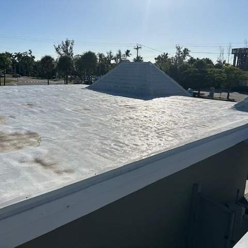 SPF flat roof with elastomeric coating defects