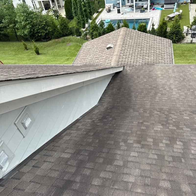Asphalt shingle roof with minor wear and flashing issues