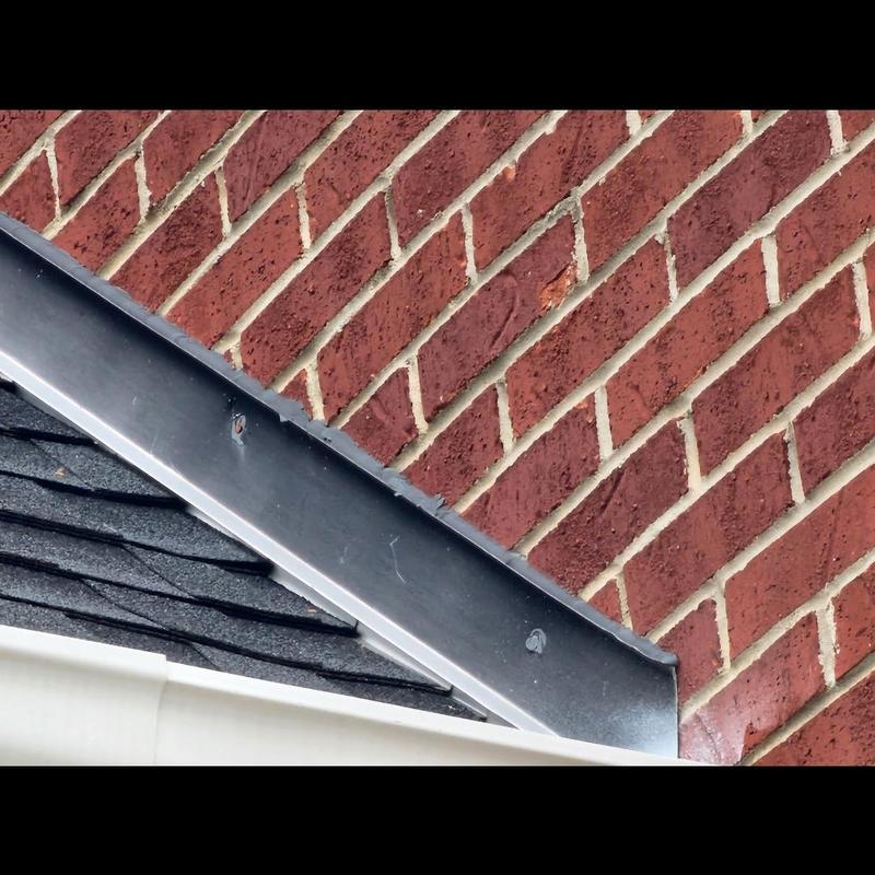 Wall flashing on rooftop with sealant applied