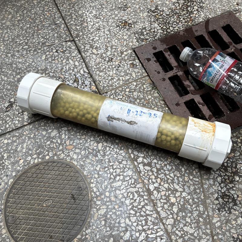 Condensation neutralizer removed from plumbing system