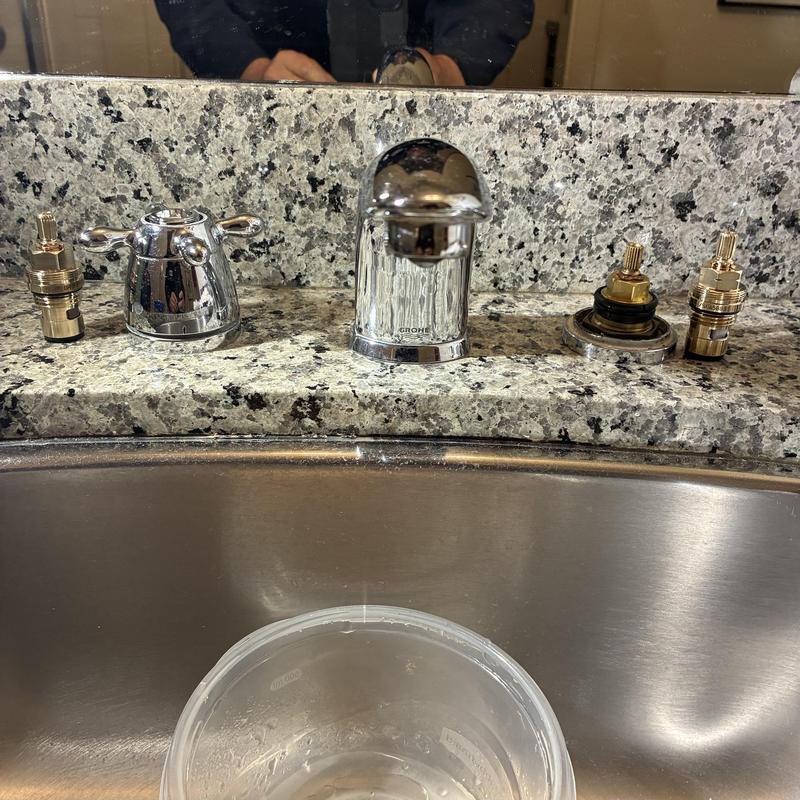 Grohe basin faucet with stems removed on counter