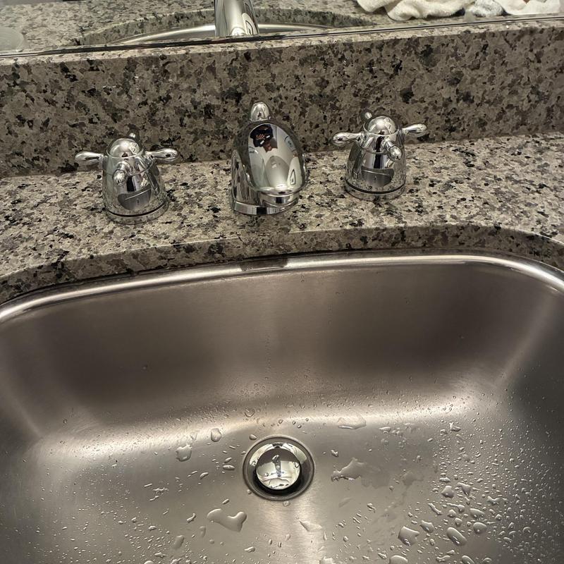 Grohe basin faucet with chrome handles on granite