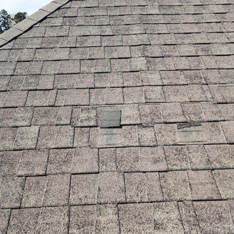Owen Corning Oakridge asphalt shingles with damage