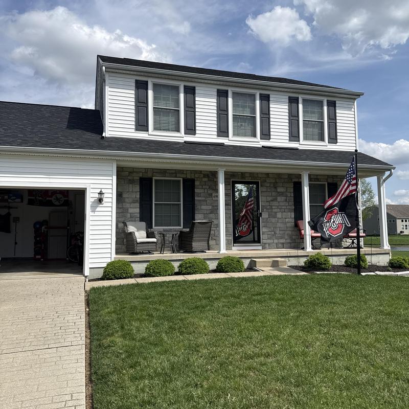 Window inspection on residential home exterior in Canal Winchester