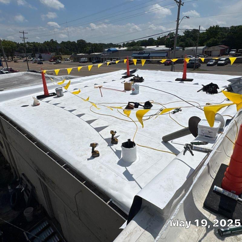 TPO roofing system installation on commercial building roof