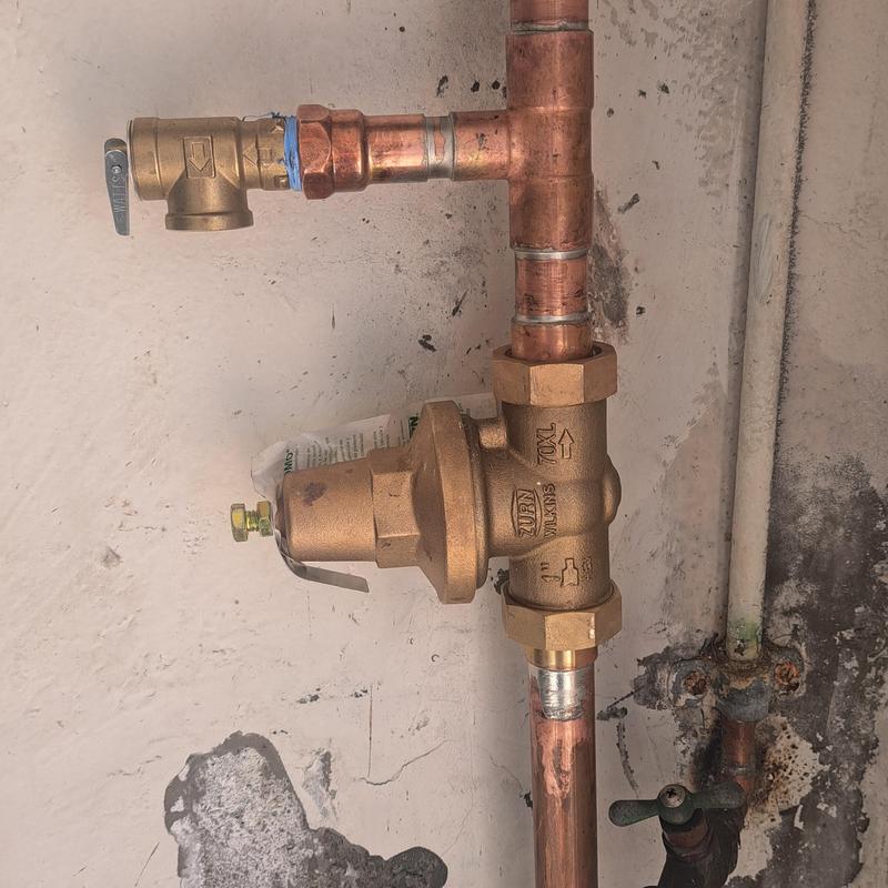 Pressure regulator and relief valve on water main