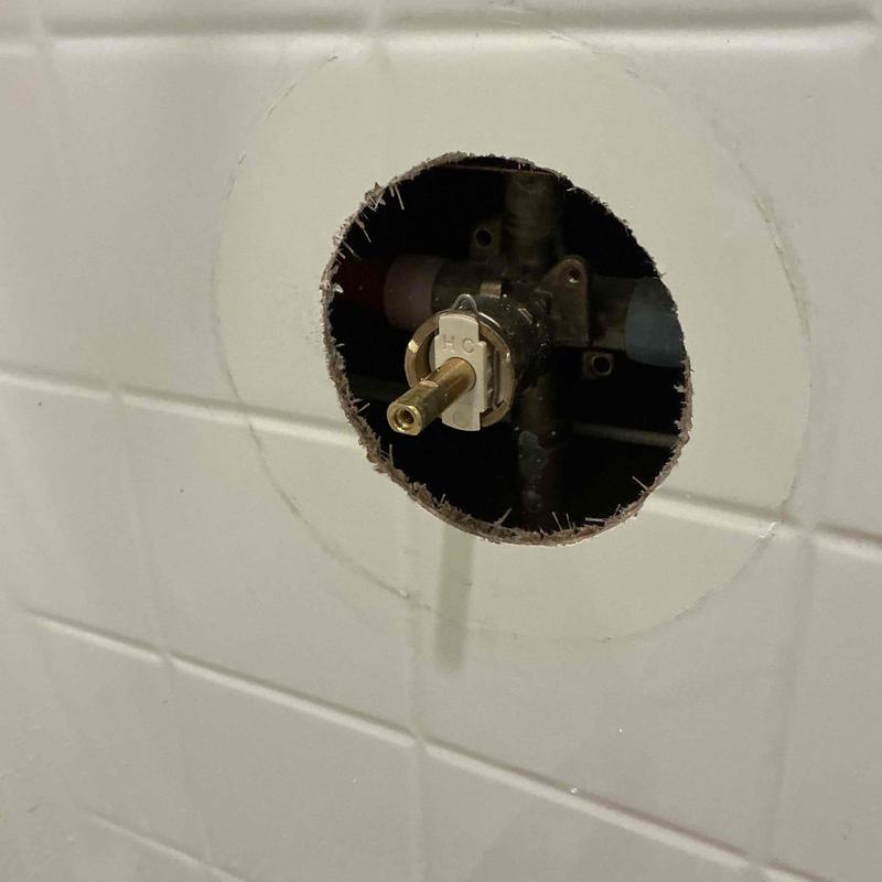 Shower valve cartridge replacement inside tile wall